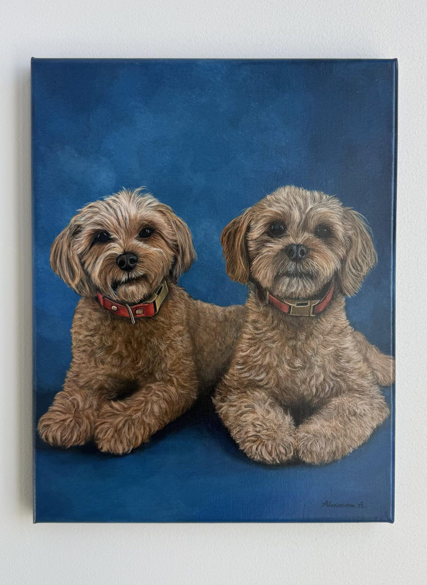 Painted portrait of two small brown dogs on a deep blue background